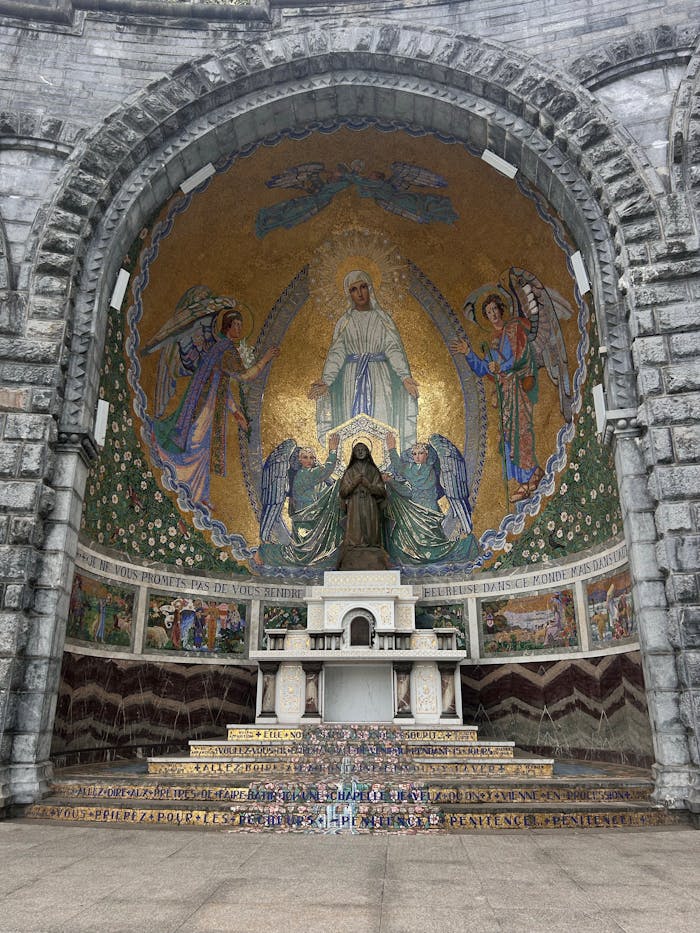 services-img Intricate mosaic art with religious statue inside cathedral niche