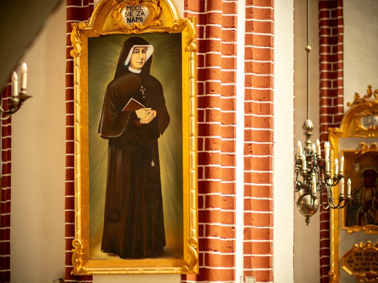 A religious painting of a saint inside a church in Wrocław, Poland.